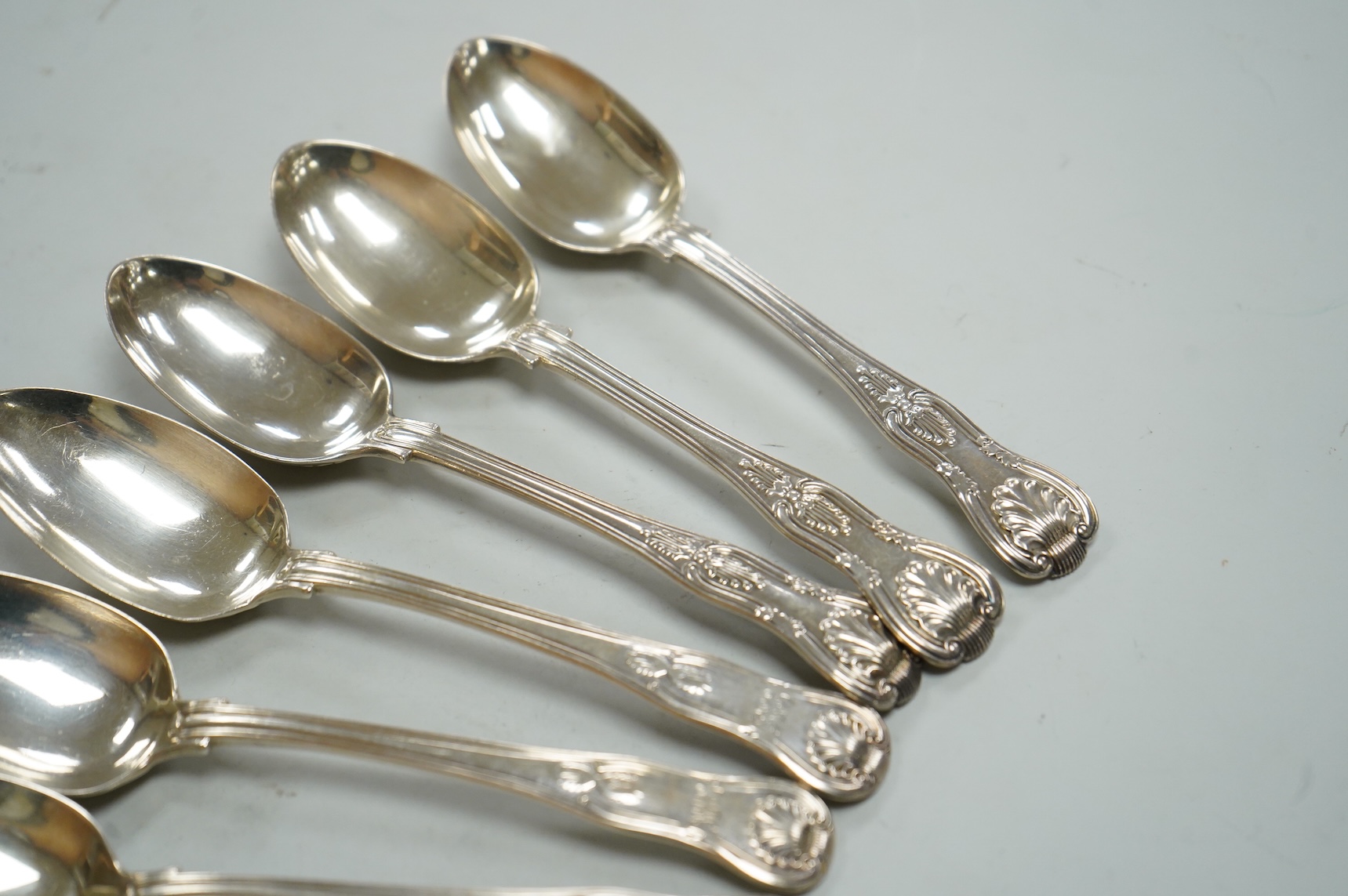 A matched set of six Victorian silver Kings pattern dessert spoons, including three by George Adams, London, 1865, 11.9oz.